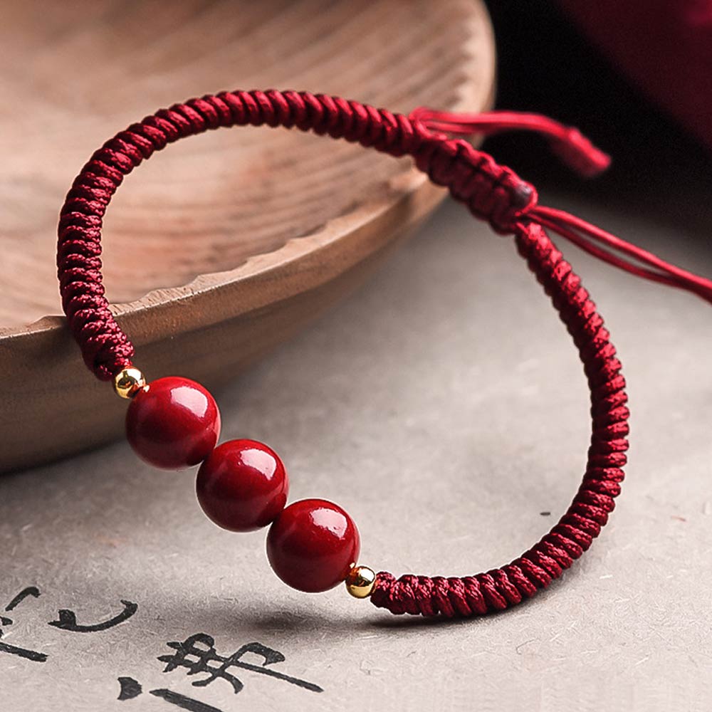 Bougie bijou bracelet perles rouges